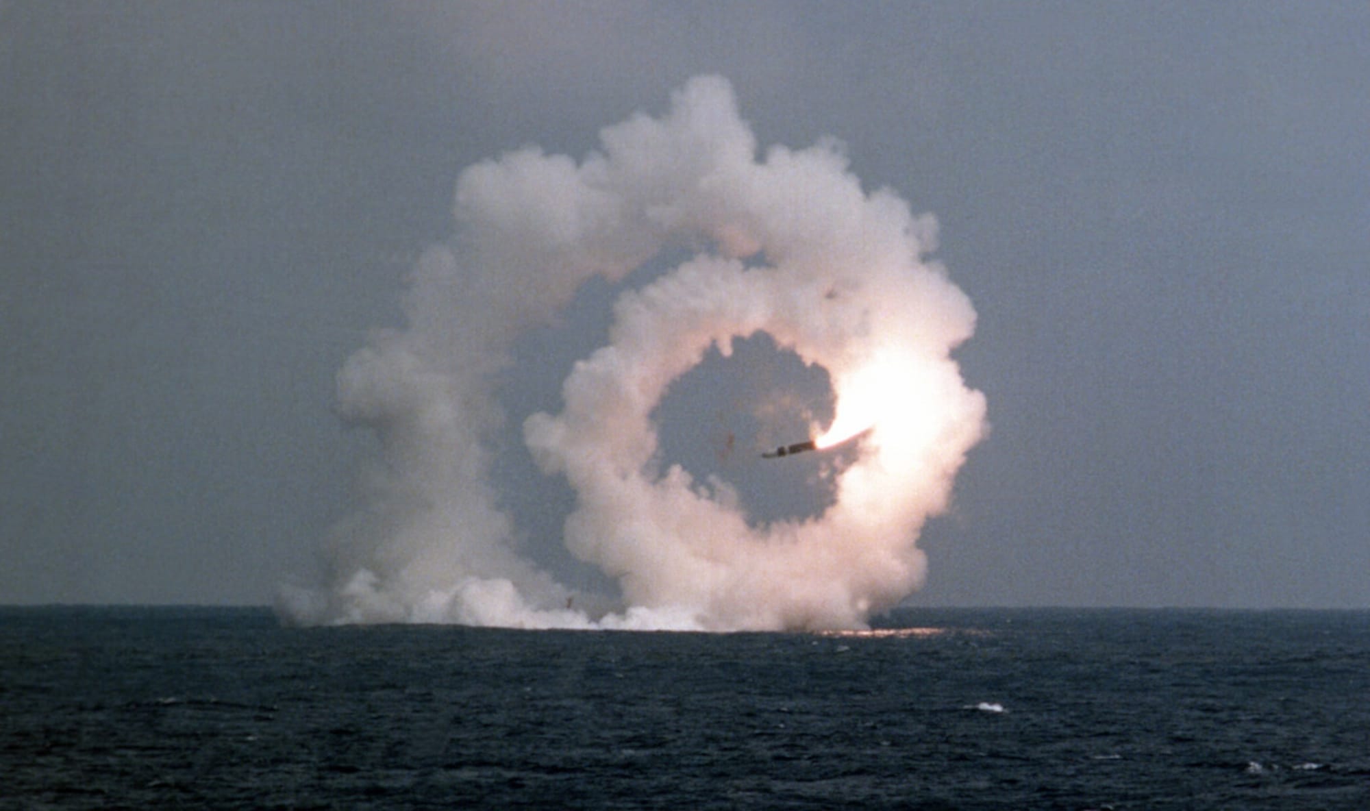 Image of trident missile flying in a tight spiral above sea after failed submarine test launch